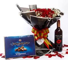 romantic red roses bouquet with wine