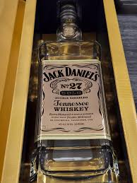 gold tennessee whiskey empty bottle