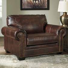 This is a cozy option whether you are a big man or you just prefer that bit of extra space. Signature Design By Ashley Roleson Chair And A Half In Walnut Nebraska Furniture Mart