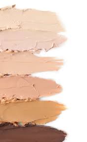 diffe shades of foundation on white