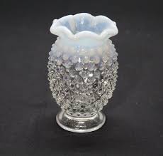 clear glass vase with white milk glass