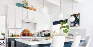 When you're decorating above kitchen cabinets with high ceilings you typically don't have to worry too much about lighting because the open space will feel bright. 14 Ideas For Decorating Space Above Kitchen Cabinets How To Design Spot Above Kitchen Cabinets