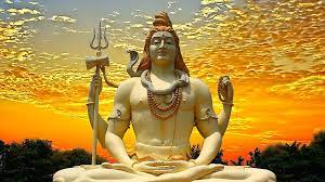 lord shiva statue in golden sky