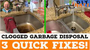 clogged kitchen sink with garbage