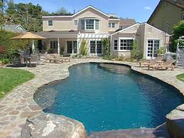 Stunning stone pool wall and water feature. Water Features For Any Budget Diy