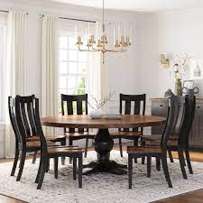 Shows like hgtv's fixer upper showcase this nurturing style in all it's comforting glory and people seem to be flocking to the look more than ever. Rexburg Black Two Tone Solid Wood Farmhouse Round Dining Table