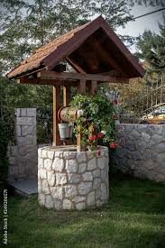 Stone Well With A Wooden Roof And A