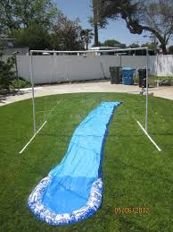 Use inflatable bowling pins and tubes for people to 'roll' in. Diy Sprinkler And Slip N Slide Setups For Summer