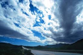 photo of empty road with big sky