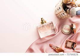 perfume bottle with makeup cosmetics on