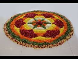 big onam flower rangoli with vibrant