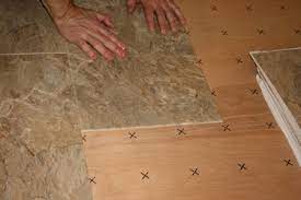 how to secure vinyl floor tile that is