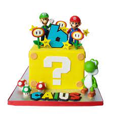 Tiered fondant cakes, a cake using a specialty cake pan, cupcake cakes, cookie cakes, cupcake towers, yellow star cake, 1up mushroom cake, mushroom cake & cupcakes, party cakes featuring super mario figures and a princess peach cake. Super Mario Cake 2