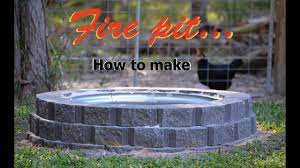 Now you know the position of the first layer of the firepit you can mark the outline by digging in a spade around the bricks. How To Make A Fire Pit Using Retaining Wall Blocks Plus Galvanised Rim Youtube