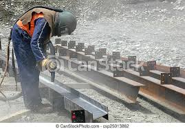 tradesman sandblasting beams