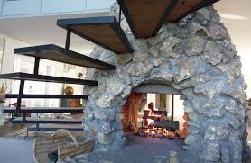 Including an oven with a stone fireplace design can add functionality to an outdoor space. Camino Bifacciale E Chiocciola Wood Burning Fireplace Inserts Double Sided Fireplace Indoor Outdoor Fireplaces