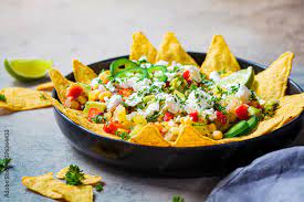 Mexican Street Corn Salad With Cheese And Nachos Chips In Black Plate gambar png