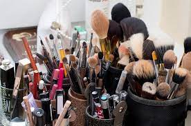 used makeup brushes and cosmetics in