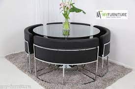 round glass dining table and black