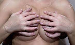 Male Hands Squeeze A Large Elastic Female Breast. The Woman Put Her Hands  On Top. Stock Photo, Picture and Royalty Free Image. Image 90395537.