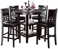 However, besides the height, there's a subtle difference between the two. Amazon Com Ncf Gaston Casual 5 Piece Round Counter Height Dining Table 4 Chairs In Black Table Chair Sets