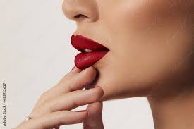 woman s lips with red lipstick