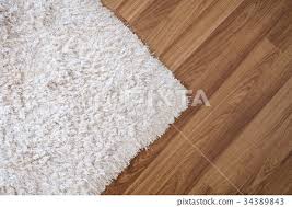 white carpet on laminate wood floor
