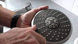 how to clean a shower head and get a