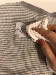 remove sticker residue from clothes