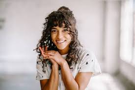 Find a stylist who understands how to cut and style curly hair. How To Grow Out Bangs Expert Tips For Every Hair Texture
