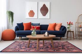 red cushions on a fancy navy blue sofa