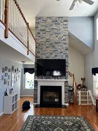 Roland S Two Story Faux Stone Fireplace