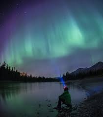 Beautiful picture of massive multicoloured vibrant aurora borealis, aurora polaris, also know as northern lights in the night sky over norway. All About Aurora Borealis Tourism Jasper