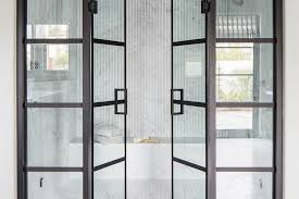 glass and steel bi fold shower doors