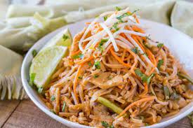 In a 2 cup measuring cup or larger, combine the fish sauce, tamarind paste, water, tamari, lime juice, chicken broth, sambal oelek, brown sugar, and tablespoon of oil, whisk until the brown sugar dissolves completely; Chicken Pad Thai Dinner Then Dessert