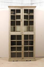 tall painted glass door cabinet mid