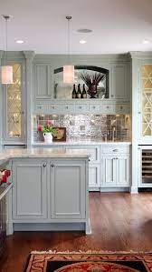 Classic kitchen in west midlands with a submerged sink, shaker cabinets, grey cabinets, light hardwood flooring, an island, beige floors and grey worktops. Light Blue Cabinetry Glass Cabinet Details Houzz Com Kitchen Inspirations Green Kitchen Cabinets Home Decor