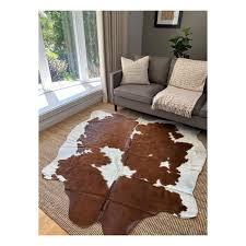 spotted brown white cowhide rug