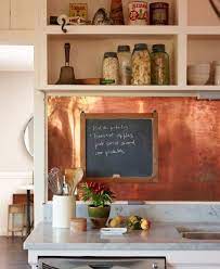 Lacquered copper backsplash in the form of sheets for a seamless look. Copper Backsplash For Kitchen Kitchen Backsplash Trends Backsplash Trends Copper Kitchen Backsplash