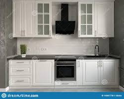 white kitchen furniture with black