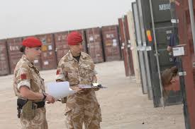 royal military police personnel inspect