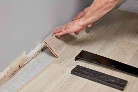 You'll be better off chipping the old tiling away and installing the laminate floor planks on a bare subfloor. How To Install Laminate Flooring