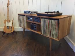 This solid wood record player cabinet is designed for storing your vinyl collection in style but its versatile design means it could also be used as a sideboard. Stunning Modern Vinyl Record Player Cabinets That Will Greatly Admire You Inspire Design Ideas Decoratorist