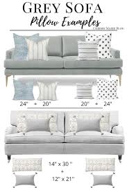 grey sofa with blue pillows up to