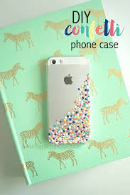 Decorate your current phone case with these cool dots or go all out and get a new white one to make something super glamorous. The Little Things Diy Confetti Phone Case Confetti Phone Case Diy Phone Case Diy Iphone Case