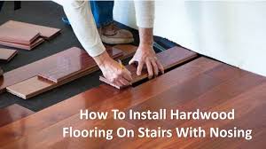 installing wood flooring up to stairs