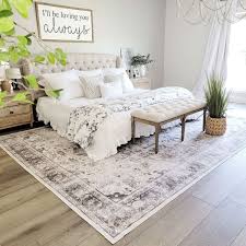 how to place rugs under beds storables