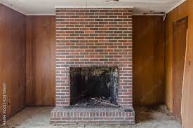 Red Brick Fireplace Set Against Wood