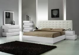 Example of a transitional medium tone wood floor and brown floor bedroom design in miami with white walls i like the idea of a bench in front of the bed, sort of like the nightstands. Modern White Dressers Stylish Bedroom Furniture Ideas