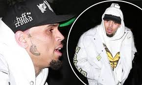 Did chris brown really get a tattoo of rihanna's bruised face?! Chris Brown Shows Off His New Air Jordan Face Tattoo As He Heads To Pre Valentines Party Daily Mail Online